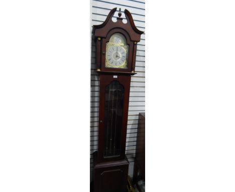 A modern mahogany finish longcase clock having eight-day Westminster chiming movement, glazed panelled long door, 212cm high 