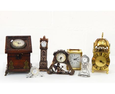 A quantity of carved wood and other decorative items including brass lantern clock, skeleton type mantel clock, etc. (2 boxes