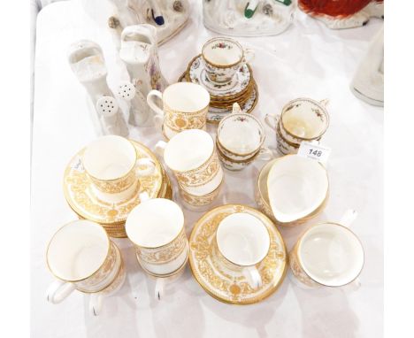 A Royal Worcester 'Hyde Park' pattern coffee set comprising 12 coffee cans and saucers, milk jug and sugar bowl, some Copelan