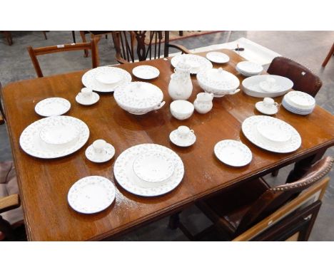 A Royal Worcester "Forget me Not" pattern part table set including tureens, dinner plates, bowls and a coffee set 