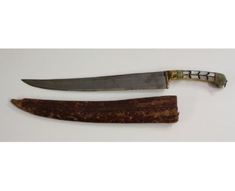 An Indian jade mounted kindjahl dagger, 23cm wootz steel curved fullered blade, the handle inlaid in the Gujarati manner with