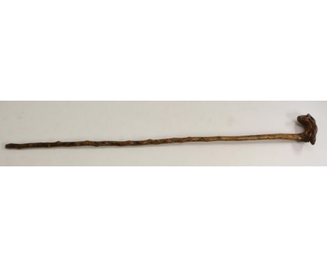 A 19th century folk art walking stick, the handle carved as a lizard, 94cm long