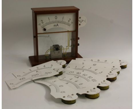 A mahogany demonstration meter, by White Electrical Instrument Co Ltd, with nine interchangable scales for volts, Amps and mA