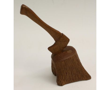 An oak desk novelty, well carved as a woodsman's axe in a tree stump, 17cm high