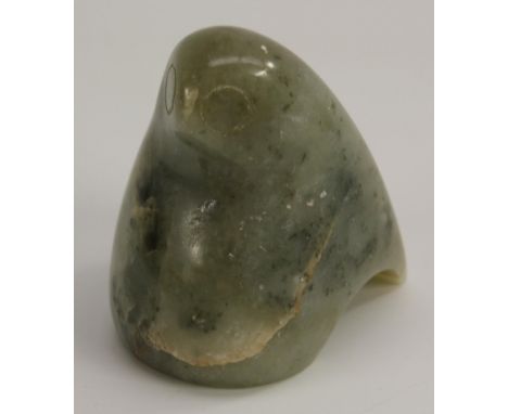 An Inuit jade carving, of a highly stylised bird, 6cm high
