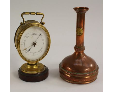 A 19th century gilt brass oval desk top weather station, the aneroid barometer with 6cm register, thermometer to verso, swing