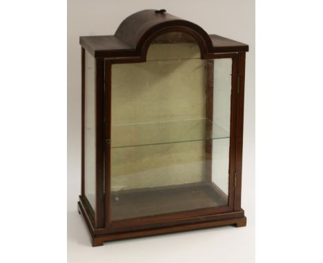 A '19th century' mahogany table top display cabinet, the domed canopy with brass axehead handle, above a glazed door enclosin