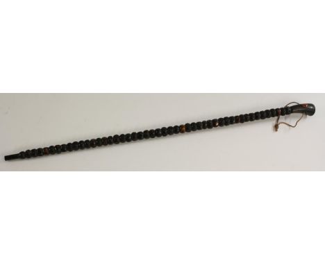 An unusual Chinese walking stick, agate mounted horn handle, the shaft formed of engraved beads, 86cm long, 19th/early 20th c