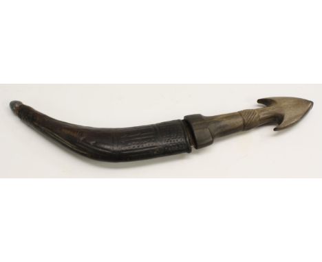 A Middle Eastern dagger, of kindjahl form, 16cm curved blade, horn handle with axehead pommel and spirally fluted grip, leath