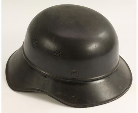 World War II - A Third Reich Nazi German M34 Feuerwehr 'salt shaker' civic stalhelm helmet, leather liner and chinstrap, indi