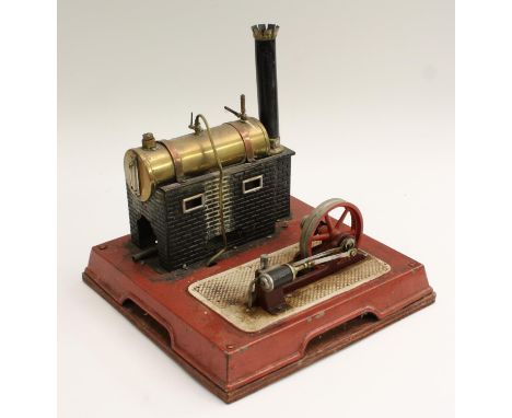A Bing tinplate tinplate live steam model stationery engine, copper-bound brass tank, 30cm wide overall, early 20th century