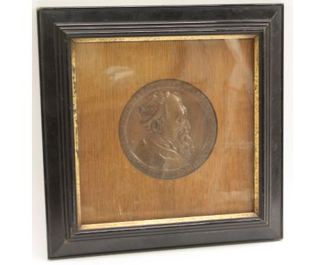 A 19th century brown patinated portrait roundel, of medallion form, with a profile bust of Michelangelo, the legend reading M