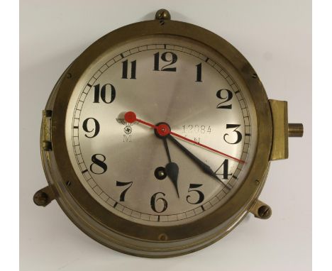 A World War II Third Reich Nazi German Kriegsmarine U-boat bulkhead clock, 16cm silvered dial with Arabic numerals, Reichsadl