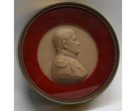 A 19th century wax portrait roundel, depicting Napoleon Bonaparte, bust length, facing to sinister, 14.5cm diam overall, bras