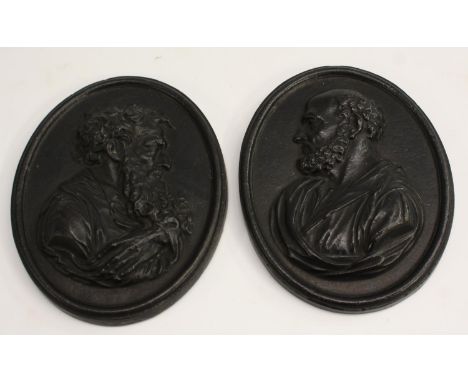 A pair of 19th century Grand Tour cast iron oval portrait plaques, in relief with gentlemen of learning