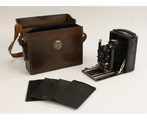 A 1920s Wallace Heaton Ltd Zodel folding plate camera, Compur Zodellax 1:4s lens, No 49058, cased with spare plates etc qty