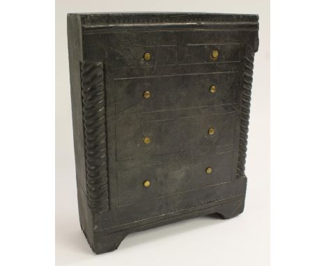 A 19th century Welsh vernacular slate model of a miniature chest of drawers, flush top above two short and three long graduat