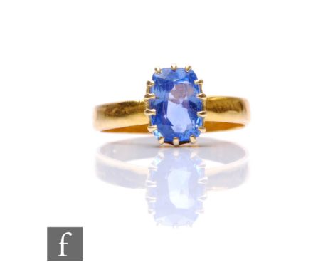 A 22ct hallmarked single stones sapphire ring, cushioned rectangular claws set stone, length 8mm, width 5.5mm, to a plain sha