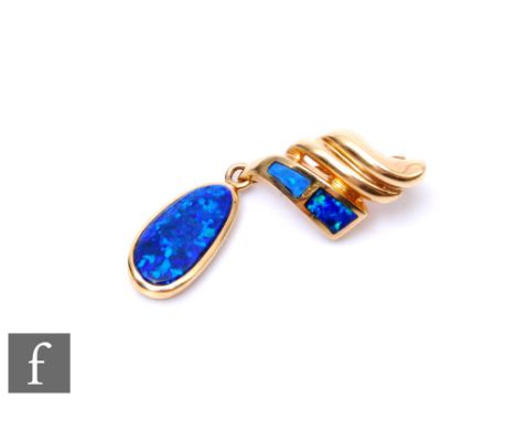 A 14ct black opal elongated oval pendant, collar set stone below scroll pediment, weight 2.4g, length of drop 30mm. 