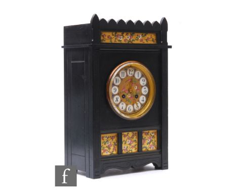 A late 19th Century Aesthetic period ebonised cased mantle clock by Saml.Marti &amp; Cie Paris, circular Arabic dial and flor