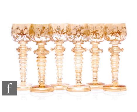 A matched set of six early 20th Century Fritz Heckert Roemer style wine glasses, each with an ovoid bowl above tapered bobbin