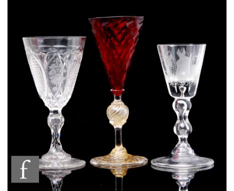 A large early 20th Century Italian Murano glass goblet in the manner of Salviati, the conical ruby bowl with diamond moulded 