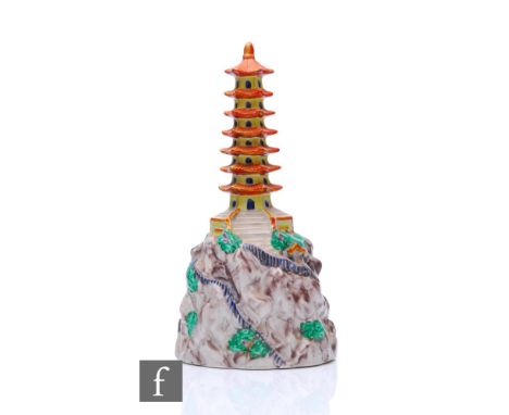 A Clarice Cliff for A.J. Wilkinson flower bowl centre block modelled as a pagoda above a rocky base, with walkways, bridges, 