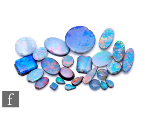 Twenty five assorted loose opal doublets and triplets to include circular, oval and pear shaped examples. (25) 