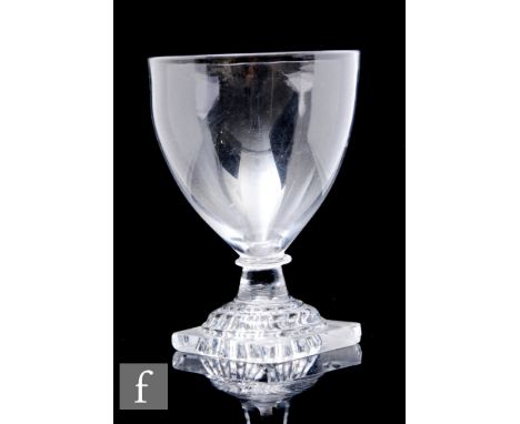A late Georgian rummer circa 1810, the round funnel bowl above a shallow capstan stem raised to a lemon squeezer foot, height