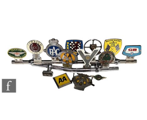 A chromed car rail mounted with seven badges to include British Automobile Racing Club, British Racing &amp; Sports Car Club,