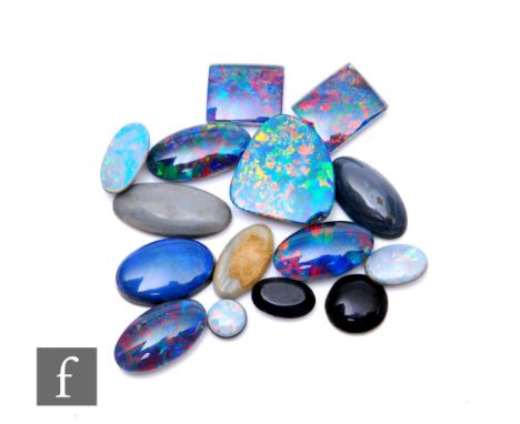 Fifteen assorted loose opal doublets and triplets to include oval and rectangular cut examples, one chipped. (15) 