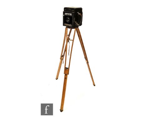 A Thornton Pickard Junior Special Ruby Reflex SLR Camera, 6 inch&nbsp;1:4.5 lens, serial No. 103713, on wooden tripod stand. 