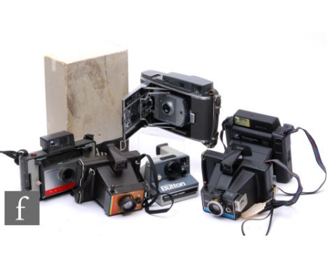 A collection of Polaroid and further instant cameras, to include a boxed model 150 land camera, Polaroid Automatic 104 Land C