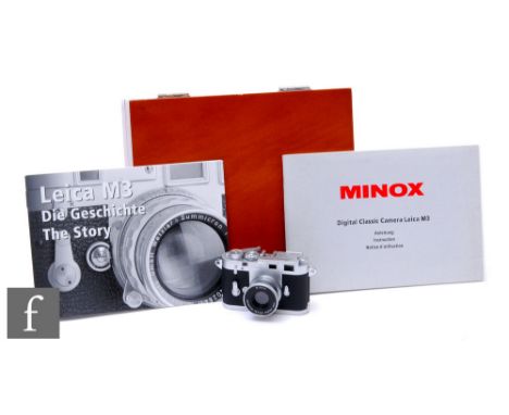 A Minox Classic Miniature Film Camera, Leica M3 version, in wooden presentation box with booklets. 