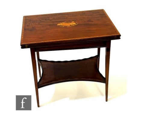 An Edwardian mahogany and satinwood cross-banded fold-over tea table of rectangular form, with marquetry inlaid cartouche to 