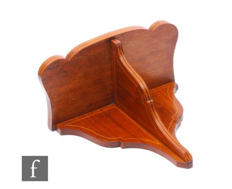 An Edwardian line inlaid mahogany clock bracket of swept outline, height 31cm. 