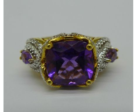 A silver gilt, amethyst and diamond ring, Q