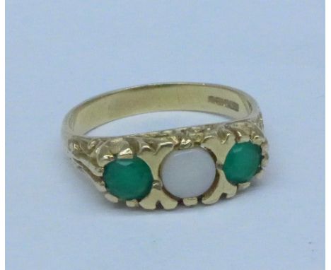 A 9ct gold, opal and green stone ring, 3.3g, O