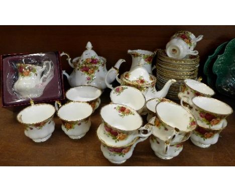 Royal Albert Old Country Roses tea ware comprising two teapots, a water jug, fifteen cups, twenty-one saucers, sugar and a mi