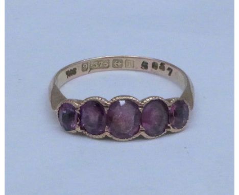 A 9ct gold and amethyst ring, Birmingham 1910, 2.1g, M