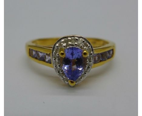 A silver gilt, tanzanite and diamond ring, S