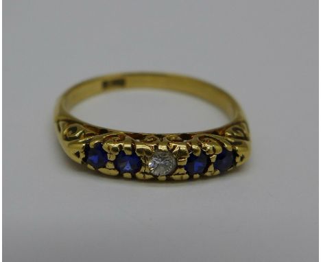 An 18ct gold, blue and white stone ring, 3.3, P