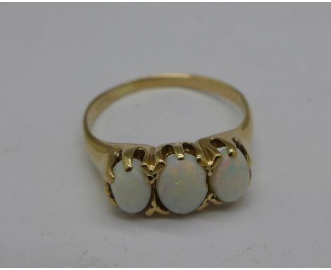 A 9ct gold and three stone opal ring, 2.9g, Q