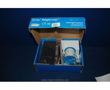 A boxed Echo Mega Loop TV Hearing Aide Amplifier, with accessories and instructions