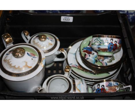 An Oriental part Teaset including six plates, four saucers, four cups, teapot, milk jug and sucrier