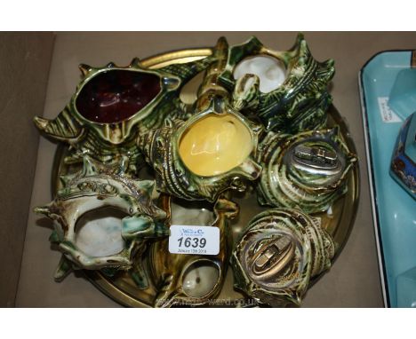 A quantity of shell shaped china ash trays and cigarette lighter.