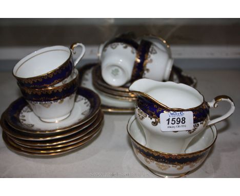 An Aynsley vintage cobalt blue gilded part Teaset including six cups, six saucers, six tea plates, milk jug, sugar bowl and c