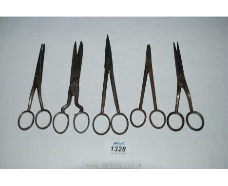 Three antique pairs of Hairdressing Scissors, a very old pair of Cutting out Shears and an old pair of Vine Scissors, makers 