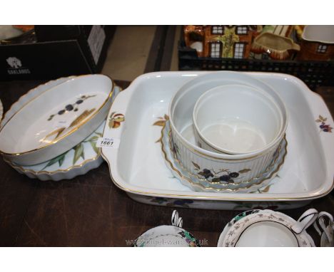 A quantity of Royal Worcester 'Evesham' Oven Dishes including large rectangular dish, three graduated flan dishes, oval dish,