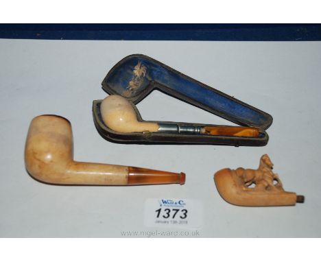 A cased Ladies Pipe with white metal stem and amber coloured mouth piece, 4 1/2" long, a short Pipe with amber coloured mouth